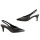 A pair of black leather slingback kitten heels with pointed toes and gold-tone buckle details, displayed on a white studio background with one shoe on a white pedestal.