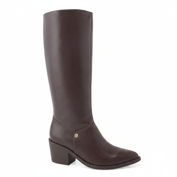 A brown knee-high leather boot with a low block heel and a small silver button accent, shown against a plain white background with a 'Genuine Leather' badge in the top right corner.