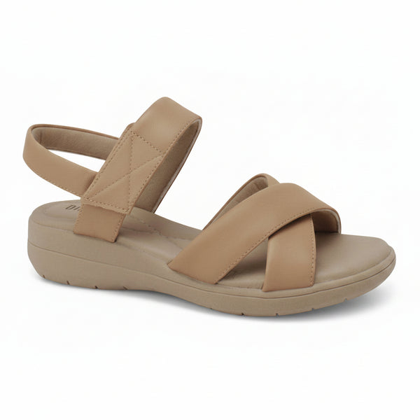 A single tan wedge sandal with crisscrossing straps and an ankle strap, shown on a white background with a 'Genuine Leather' badge in the top right corner.