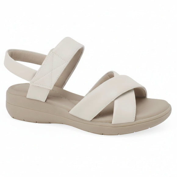 A single women's wedge sandal in off-white and beige, featuring crisscrossing straps and an adjustable ankle strap, shown on a white background with a 'Genuine Leather' badge in the top right corner.