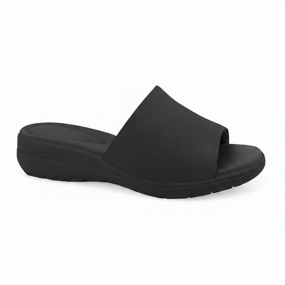 A single black slide sandal with a wide, padded upper strap and a thick, cushioned wedge sole, shown from a side profile on a white background.