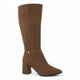A black knee-high suede boot with a block heel and a small gold button accent near the ankle, shown on a white background with a 'Genuine Leather' graphic in the top right corner.