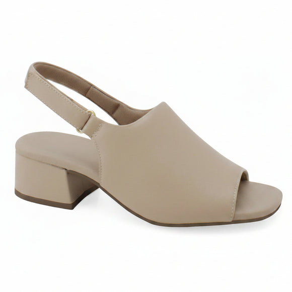 A beige slingback block-heel sandal with an open toe, shown from a side profile on a white background. A 'Genuine Leather' badge is visible in the top right corner, and the brand 'DINASTY' is printed on the insole.