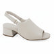 A light beige slingback block-heel sandal with an open toe, shown from a side profile on a white background. A 'Genuine Leather' badge is visible in the top right corner, and the brand 'DINASTY' is printed on the insole.