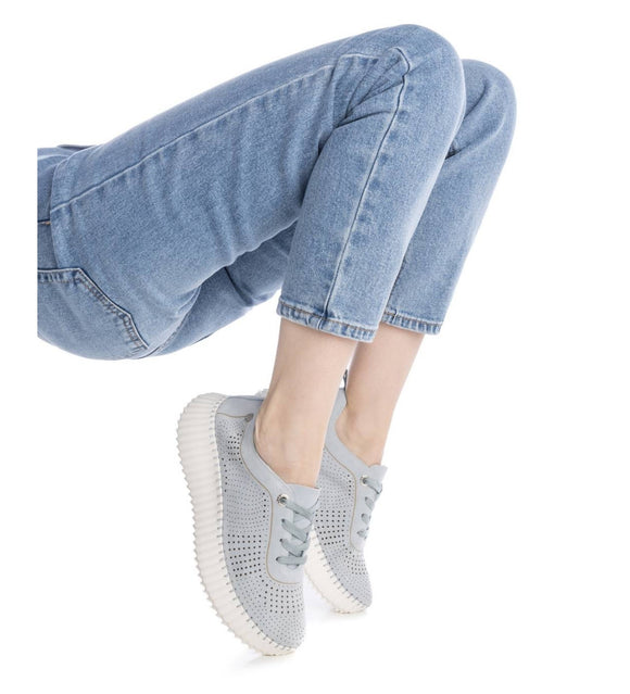 Bring comfort and style together with the Carmela Lasercut Suede Sneaker – Model 162325