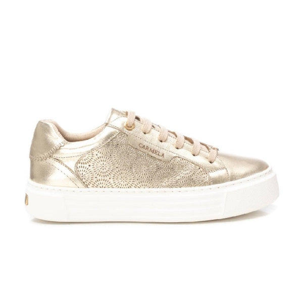 Gold carmela sneaker with white sole on a white background