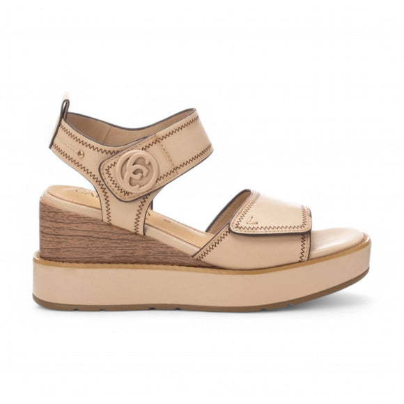 Step into effortless style and comfort with the Carmela Leather Wedge Sandal from Myshoeshop.co.za