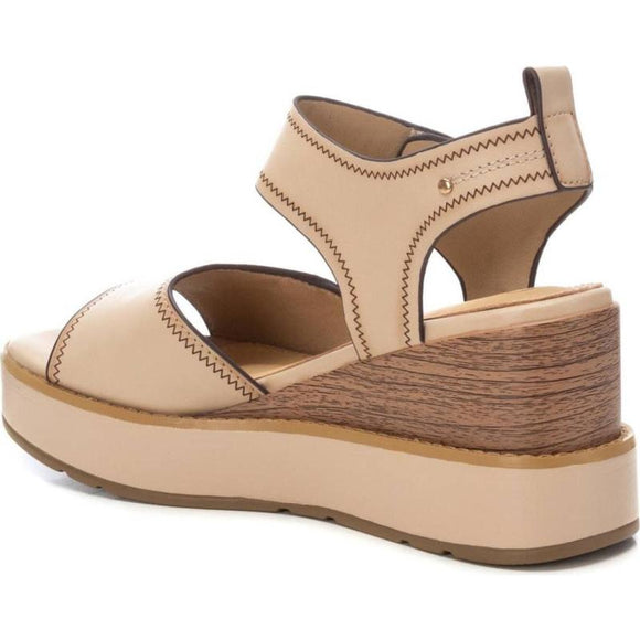 Step into effortless style and comfort with the Carmela Leather Wedge Sandal from Myshoeshop.co.za