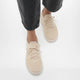 FitFlop Super-Q Paris Beige knit laced sneakers worn with cropped dark jeans.