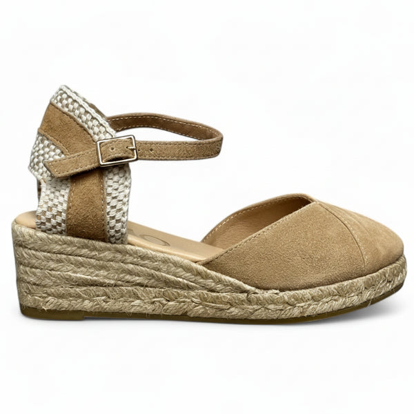 Beige wedge sandal with espadrille sole on a white background