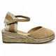 Beige wedge sandal with espadrille sole on a white background