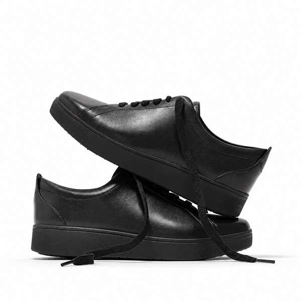 FitFlop Rally X22-090 All Black leather sneakers, stacked pair showing both side profiles