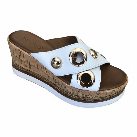 Inuovo 8790 white leather slip-in wedge with cork sides, studded straps and gold eyelets.